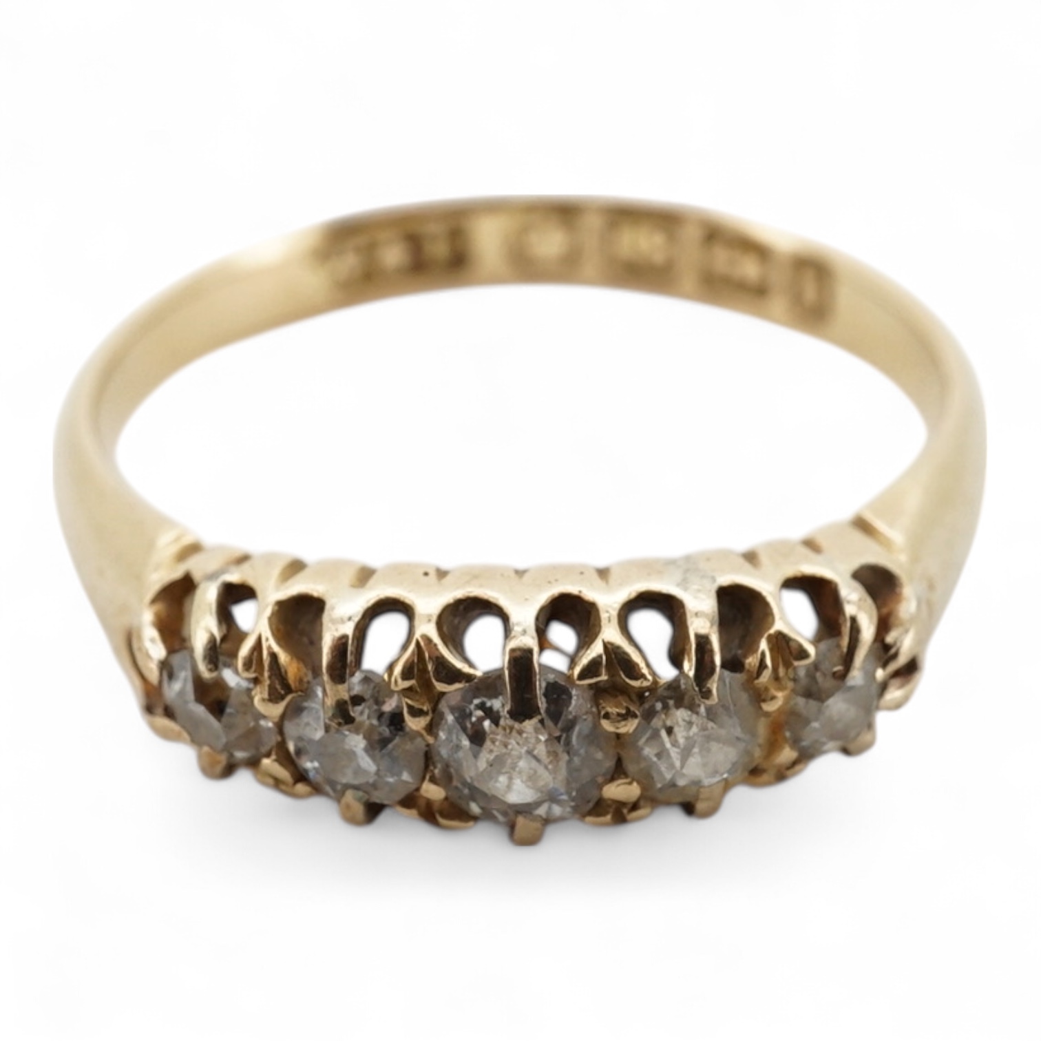 A late Victorian 18ct gold and graduated claw set five stone diamond ring, size N, gross weight 2.8 grams.